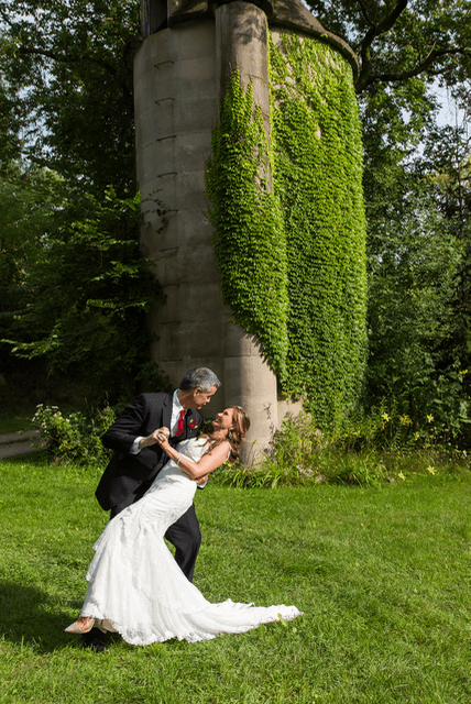 Cris dipping and kissing Shirley on their wedding day