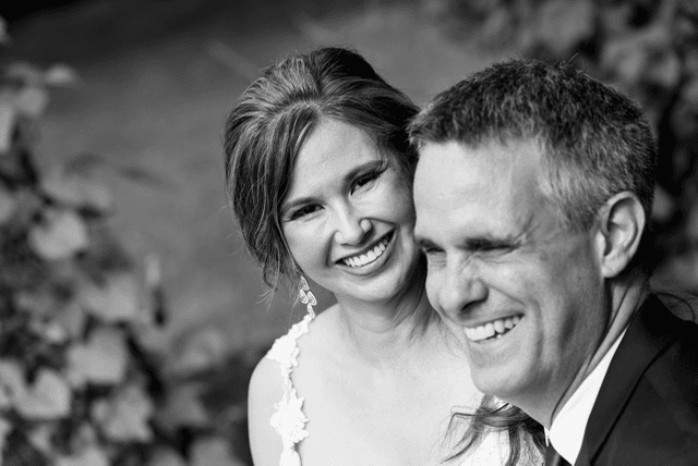 Shirley and Cris laughing together on their wedding day